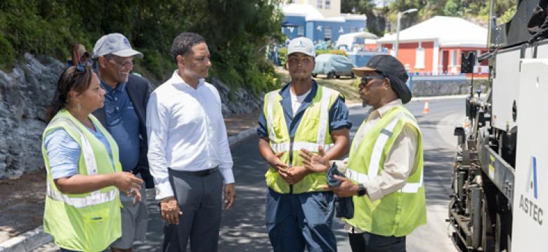 Tina Beer-Searle, Kim Swan MP, Minister Adams, Q'Shai Darrell, Skilled Labourer with the Highways Section and Nathan Darrell, Superintendent with the Highways Section.